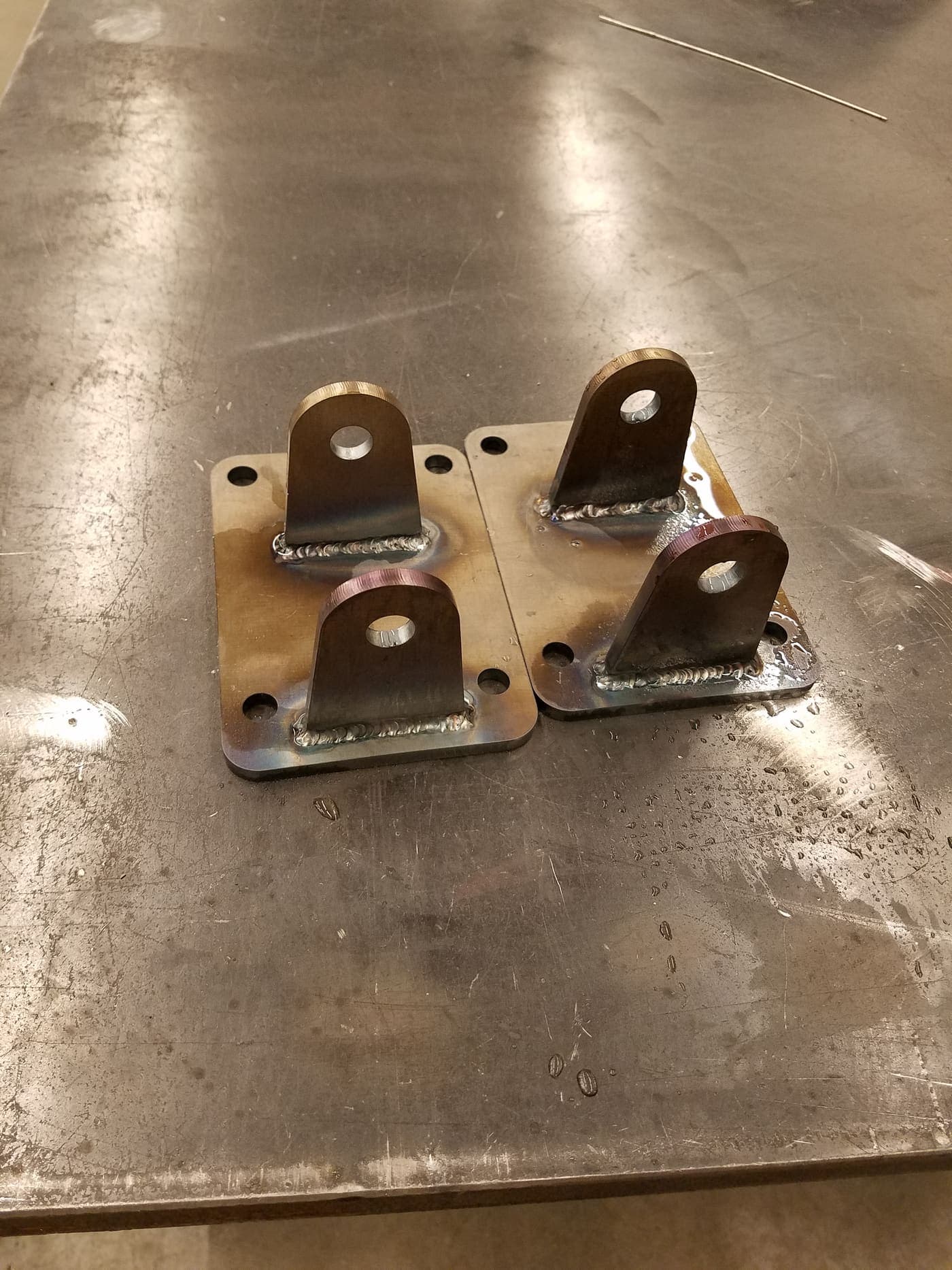 Stainless steel base plates with welded lifting lugs and clevis tabs
